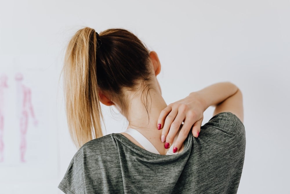 https://www.pexels.com/photo/woman-touching-her-back-4506105/